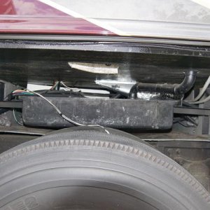 Passenger side wheelwell with gray tank exposed. Inner wheelwell removed to provide access.