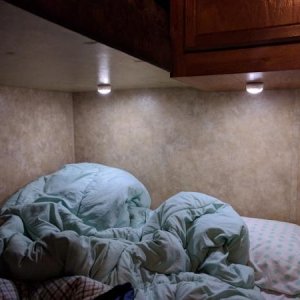 Multi-color LED touch lights with built-in timers for bottom bunk.  On this model, there is no lighting on the bottom bunk.