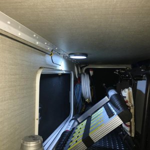 Door actuated led light in storage compartment