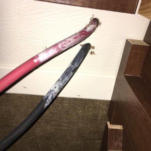 Wires from roof enter through ceiling of street side wardrobe cabinet