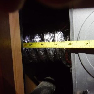 6 inches between furnace and wall.