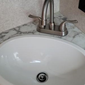 Bathroom Faucet - Replaced the original with a faucet that extends further into the sink.