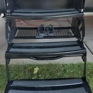 Step Shoe Rack - Utilizing the empty space behind the steps to store sandals.  This is great to keep sandals outside and not in the walkways of the tr