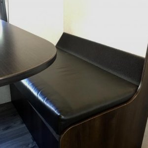 I cut a section of foam “Gutterstuff” to the width of the dinette seat. With the seat back in place, it doesn’t show and makes the angle more comforta