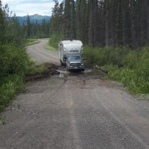 Marian fording a beaver dam