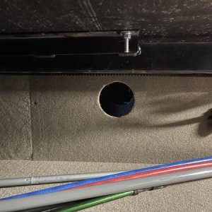 Storage bay escape hatch