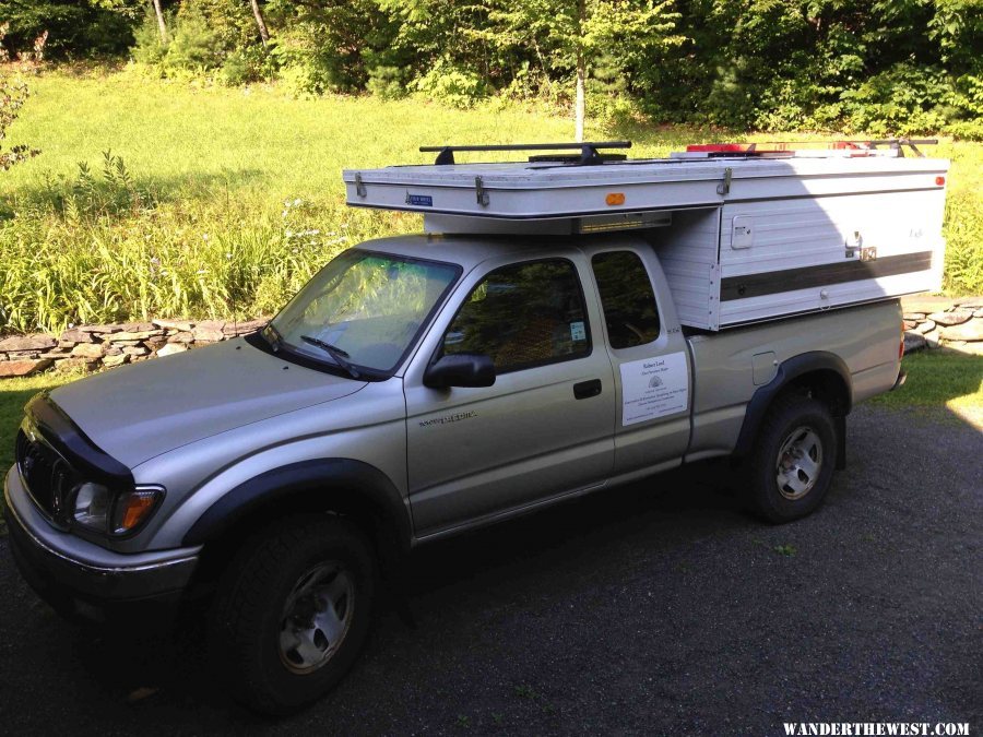 1 Our 2011 Eagle with a wind foil and solar panel box over cab.