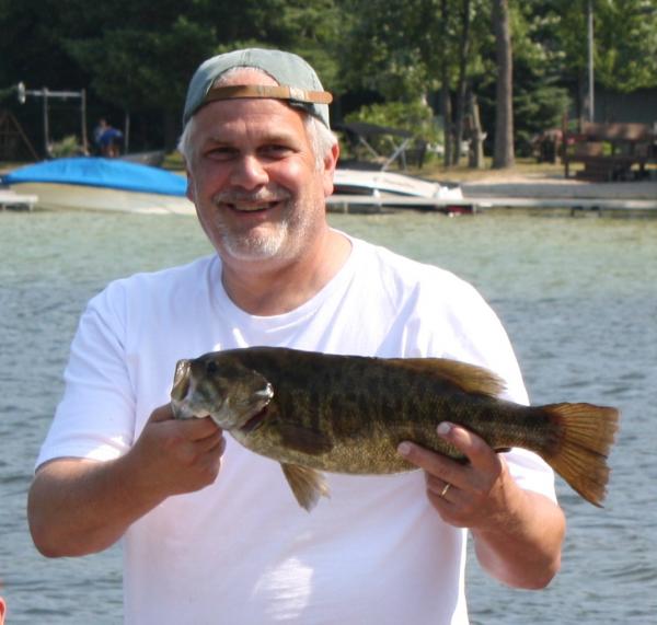 4.75 lb smallmouth with a 270 lb smile. (7/2010)