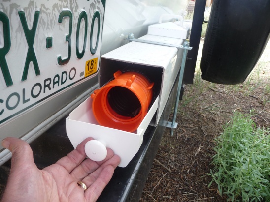 4 inch plastic gutter with end caps and cabinet knob.