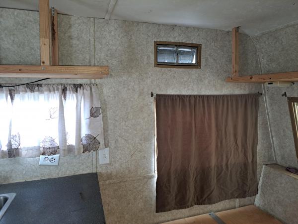 7   area between kitchen and front bed