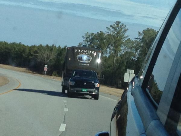 A shot from the Dodge Journey looking back in the side view mirror at our Ram 1500 pulling the SF32RL.