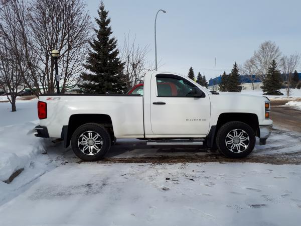 Added a 2.25" Leveling kit and went to18" rubber from the stock 20"