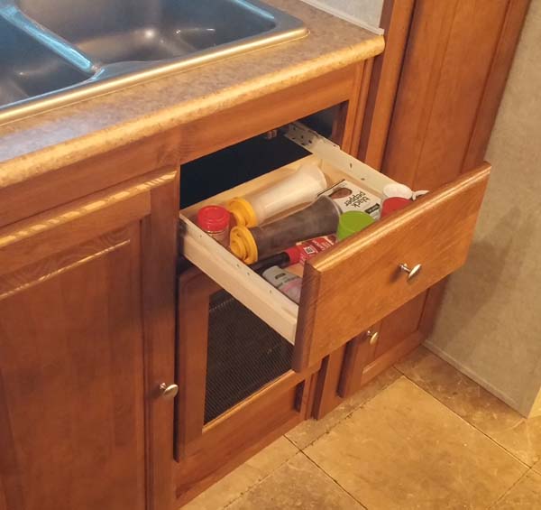 Added a small drawer under the sink. Works great for small stuff.