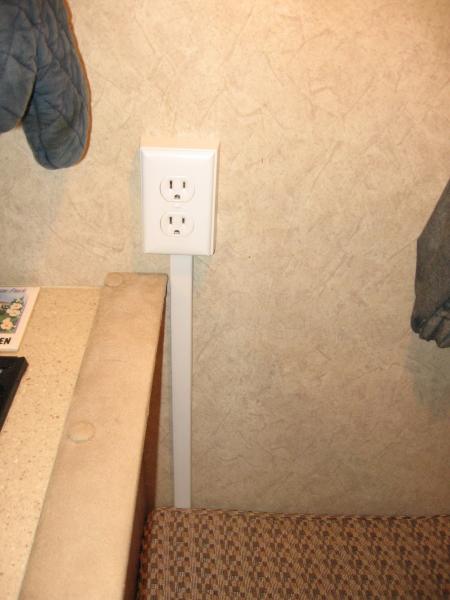 Added outlet next to the range. When in place, the back cushion hides the wire cover going up the wall.