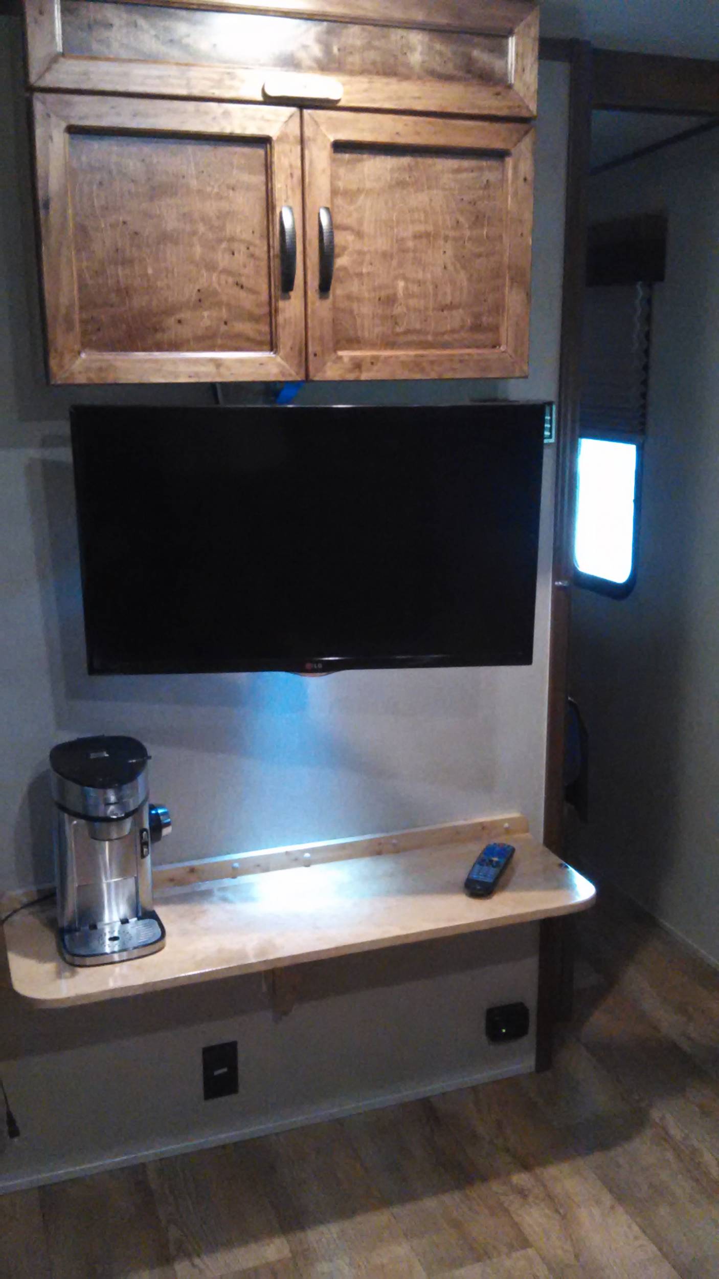 Added shelf below TV