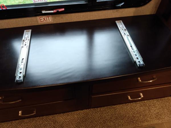 Added soft close drawer slides to top of dresser to accommodate a sliding desktop