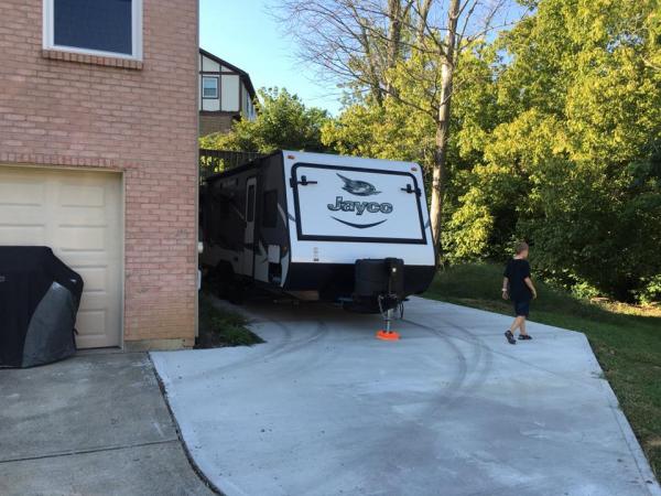 Almost got it positioned perfectly.  Would like it about a foot closer to the wall.  Need to get a trailer dolly to help move this thing.  Hooked and 