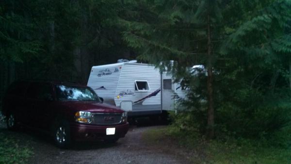 Avalanche Creek campground.  Nestled in a corner site and surrounded by cedar trees.  On a hot summer stays, this is a preferred spot.  It can be 90-1