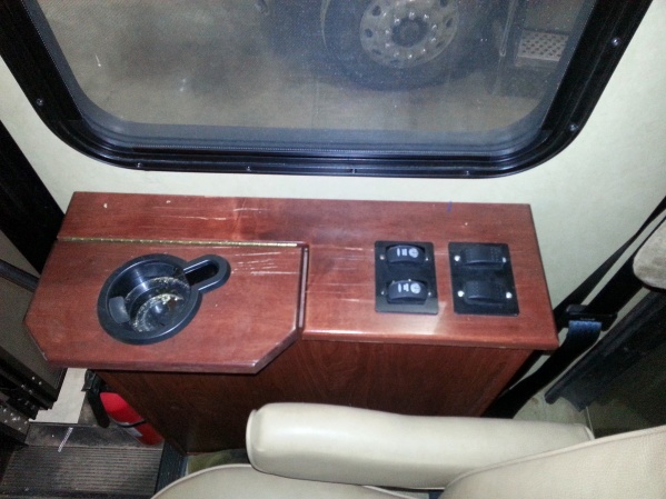 Back row of light switches on passenger arm rest.  1 operates passenger map light, other operates outside LED light strip.