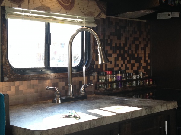 Backsplash, spice rack and trim around window.