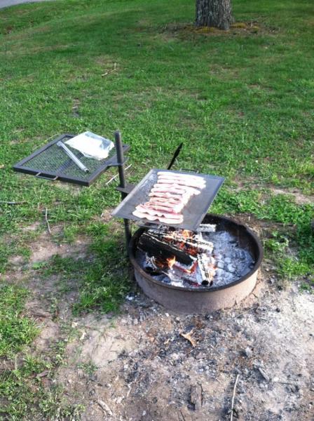 Bacon for breakfast on the open campfire.