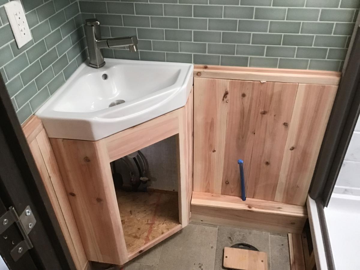 Bath upgrade corner sink and cedar walls