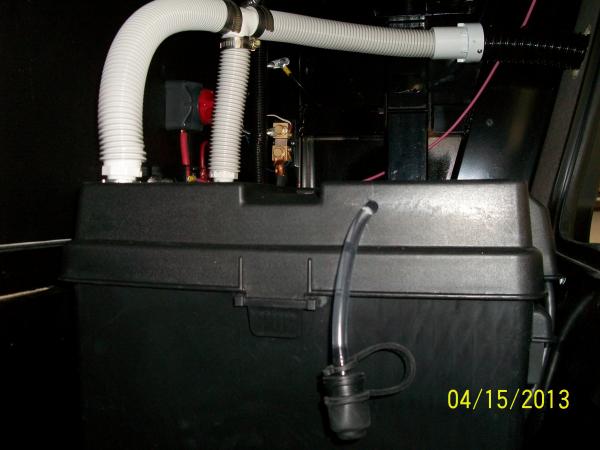 Battery Box Vents fabricated from left over Central Vacuum Hose.  Also shows JWP Battery Watering tube, which supplies water to both batteries when se