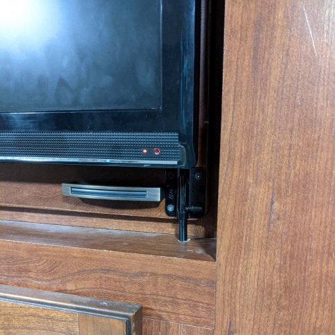 Bedroom TV latch to stop it from swinging open on the road