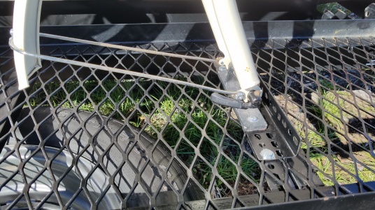 Bike fork secured with the Bike Tight. A heavy rubber bunge to hold down the rear tire works well. Use a ratchet strap on the bike for extra security.