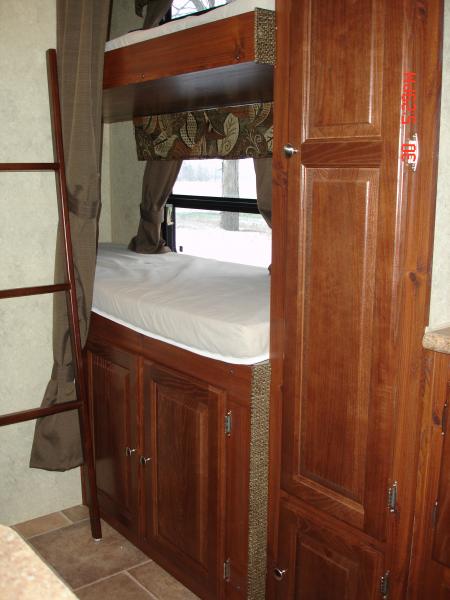 Bottom bunk with storage