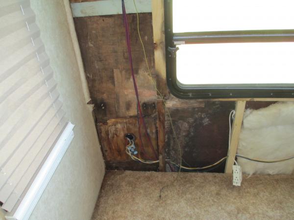 Bottom of wall. Wall extends several inches below floor.