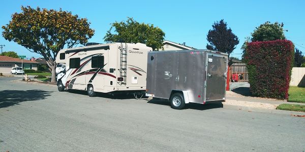 Brownie with new trailer on our street.