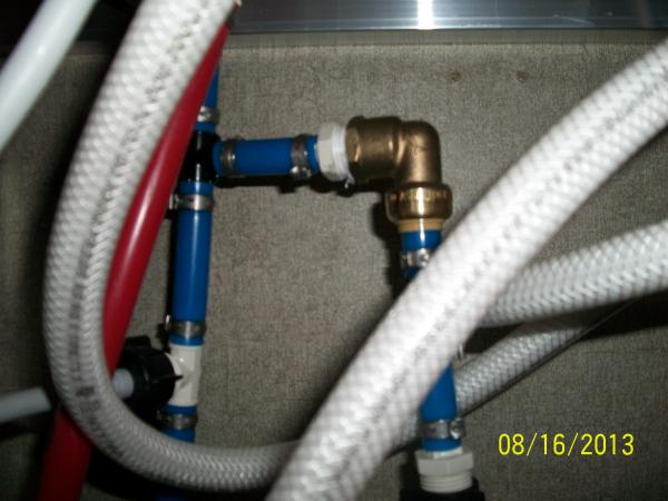 Bypassed OEM Water Filter using a 1/2" FPT X 1/2" Shark Bite fitting.  Only cut the right PEX, and unscrewed Filter Head from existing 1/2" MPT that w