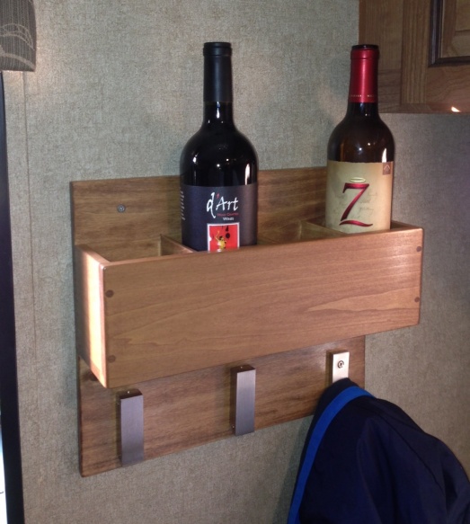 Closeup of custom 4 bottle wine rack and coat rack.