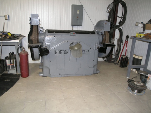 Cool old grinder made by Norton abrasives, 20HP 3 phase, 30"X3" wheels.
can be seen in operation on You Tube, I let someone record and upload it, List