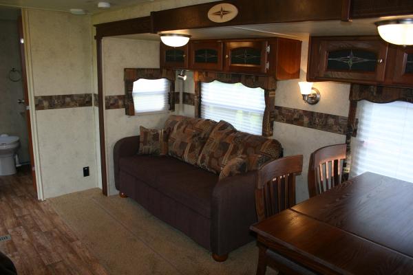 Couch w/Air Bed, Overhead Cabinets w/Glass Filled Doors