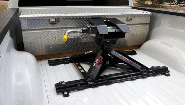 Demco Recon fifth wheel hitch.  The pyramid platform design leaves a lot of free space in the bed, head tilts in both directions.  Also comes in a goo