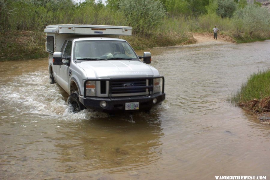 DirtyDog and Diego Fording the Fremont River as Semimike Waits His Turn