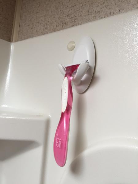 Double Command Hook used as a razor holder.