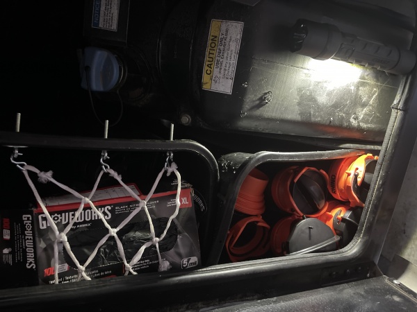 Finished Project.  Two trash cans stacked fill the volume perfectly.  Secured trash cans to motorhome with sheet metal screws into frame with large wa