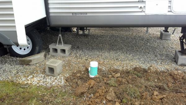 First steps, gravel under camper...
Sewer is now all hooked up and working...