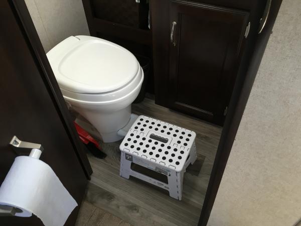 For less than $8 we found a folding stool to allow DW to reach bathroom vent fan switch.