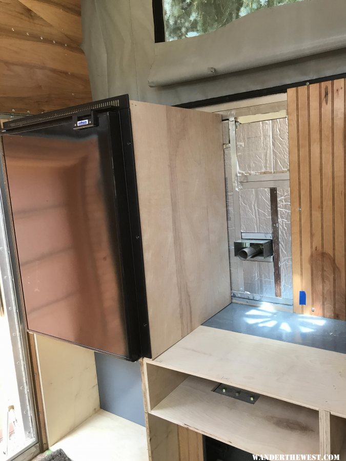 Fridge surround cabinet set in place