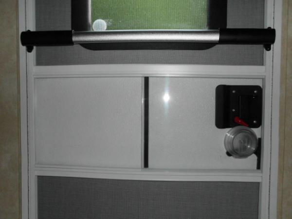 Front door closed- Lippert Components, Inc - Slider; Screen; Towable W/Knob #239061 & Camco 42183 RV Screen Door Cross Bar