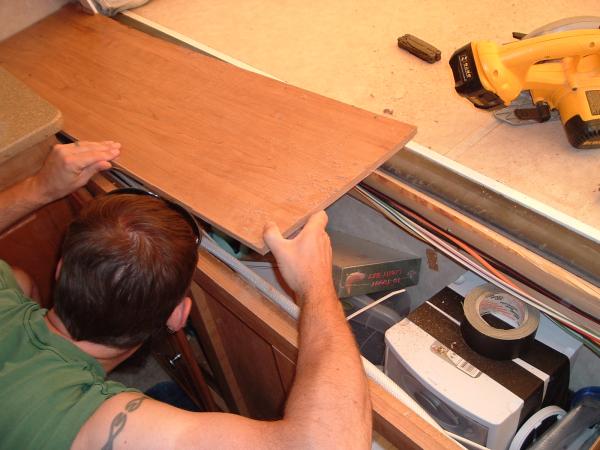 Front shelf 4: To remove the shelf we had to cut it in half.  After removing screws and staples we pulled shelf an inch or so and cut with a circular 