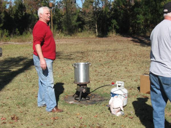 Getting the cooking oil hot to fry the turkey.