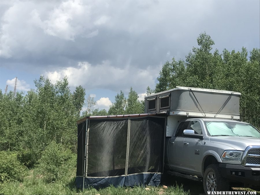 Granby camper popped up with awning and screen room