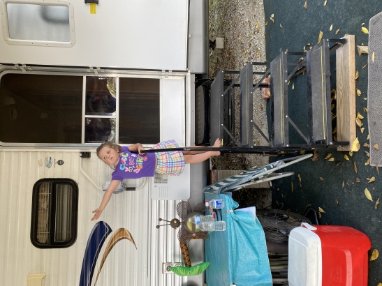 Granddaughter showing off camper