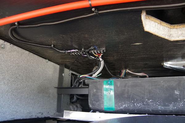 Gray tank SeeLevel sensor and wiring installed. Also visible is hot water return line heading back to fresh water tank.