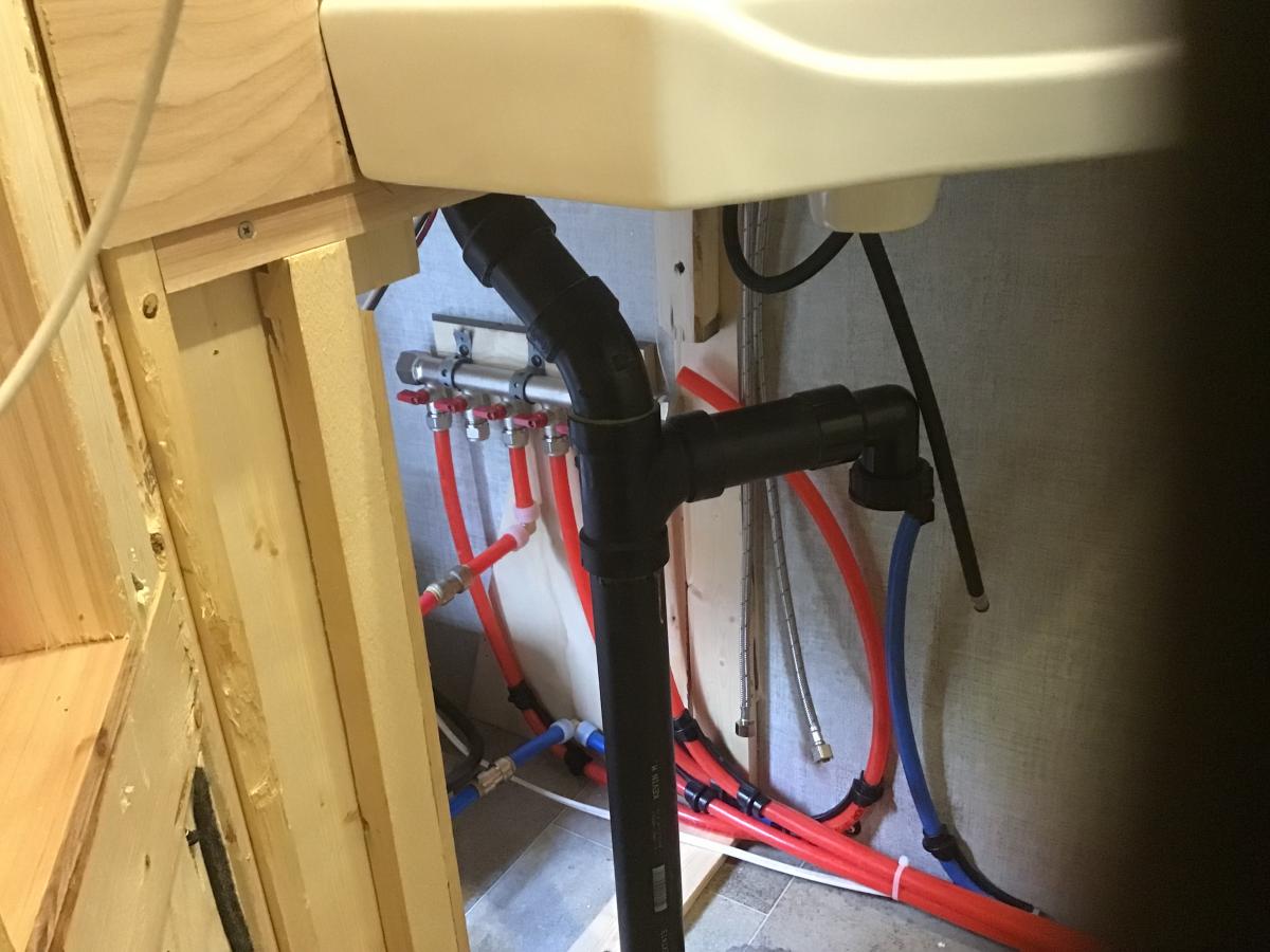 Hot water header by water heater